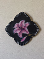 Oil Painting of a pink lily flower with an ornamental border on a white wall