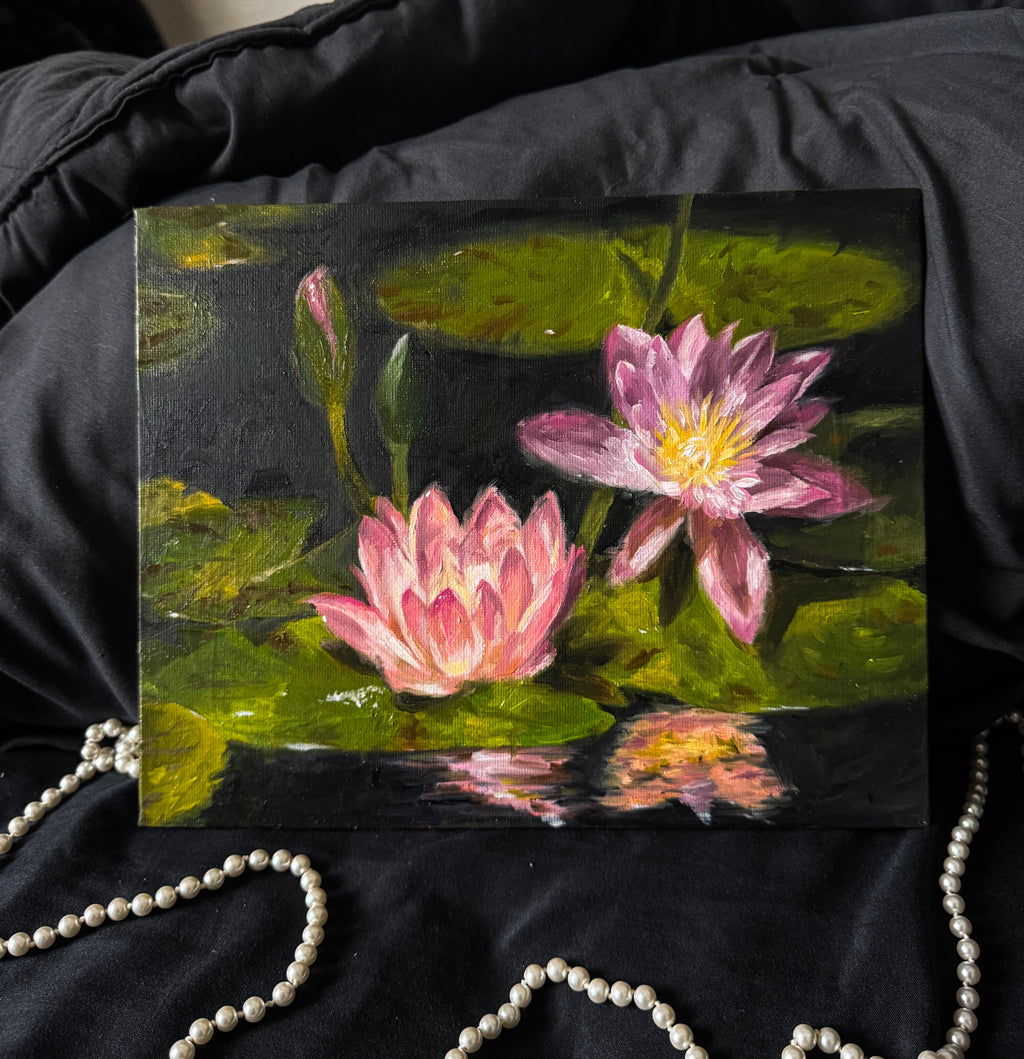Oil painting of pink water lilies on a dark surface with pearls in the background