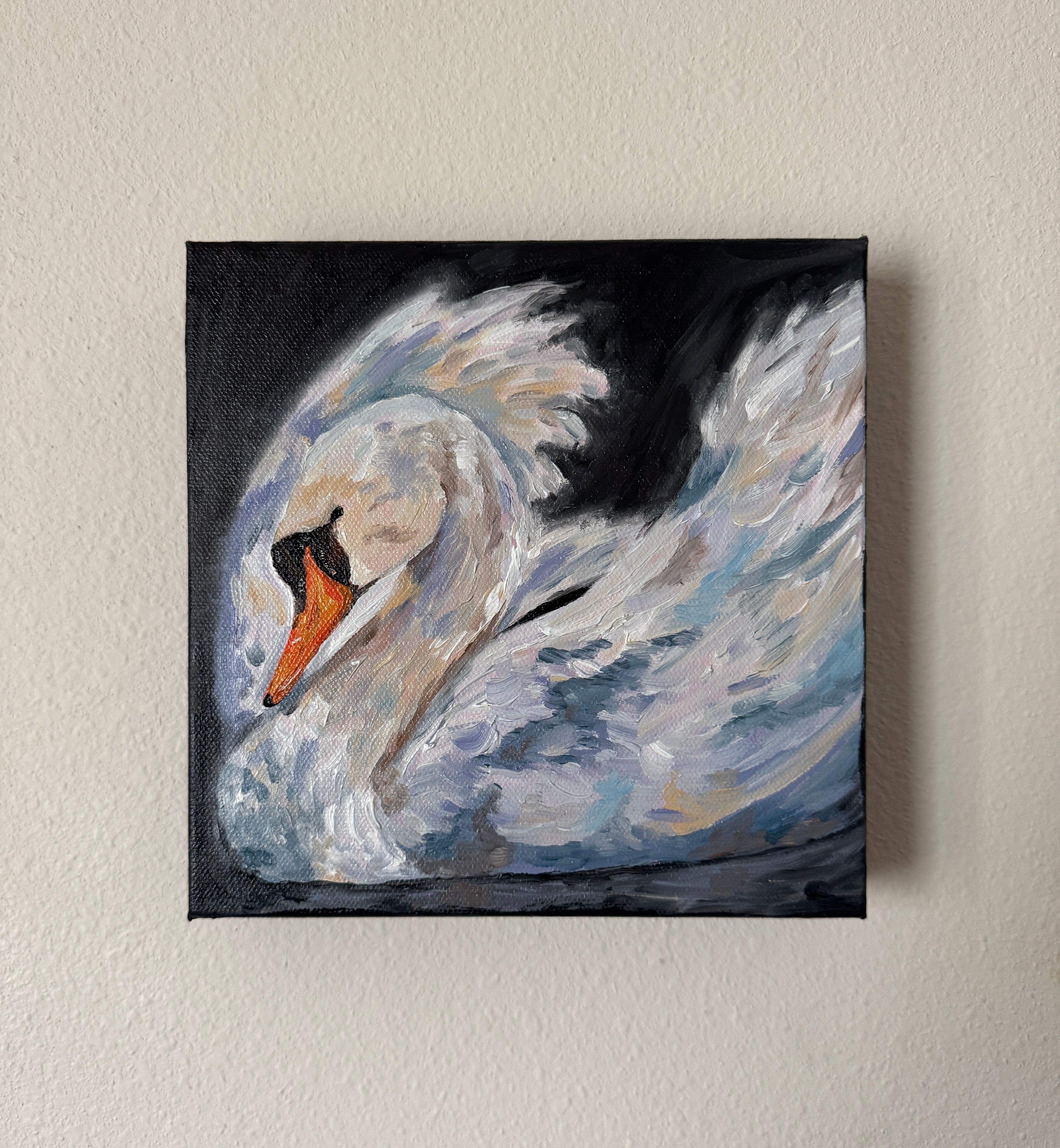 Painting of a swan on a beige wall
