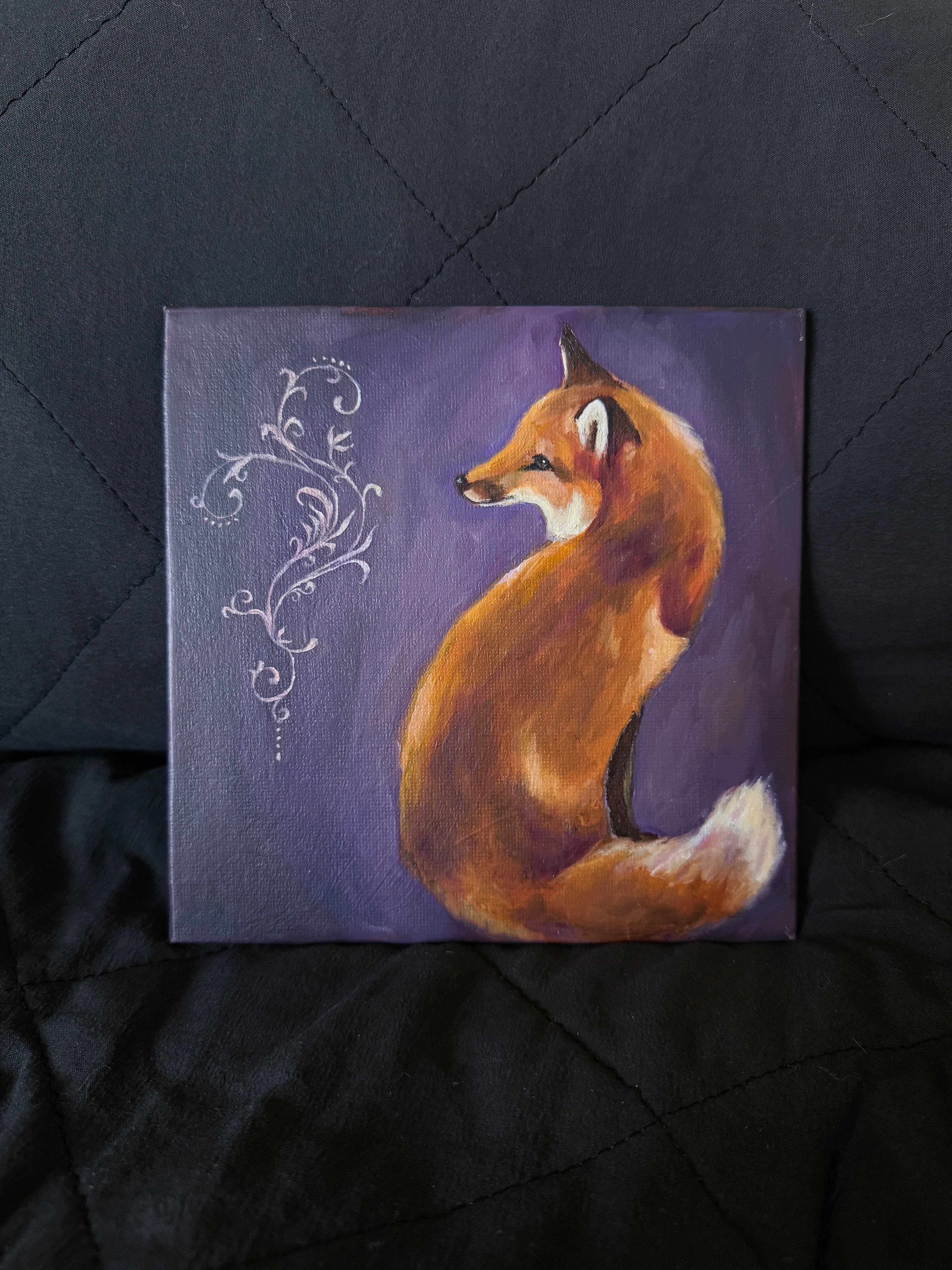 Painting of a fox on a purple background with ornamental elements