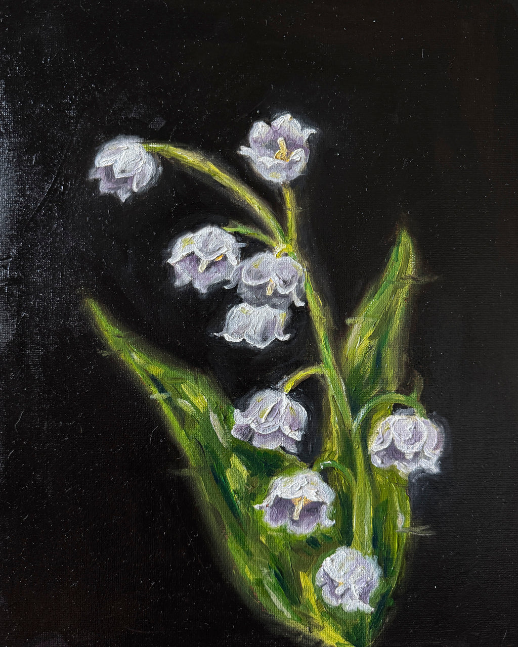 Painting of a flower with green leaves on a black background